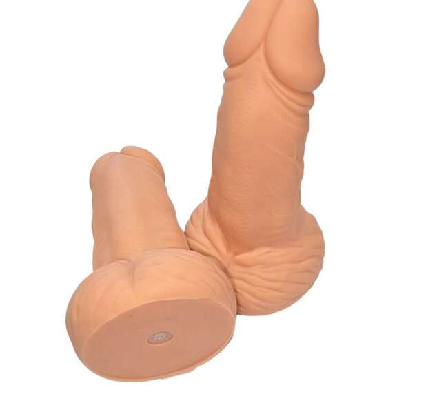 Penis-shaped whistle with testicles